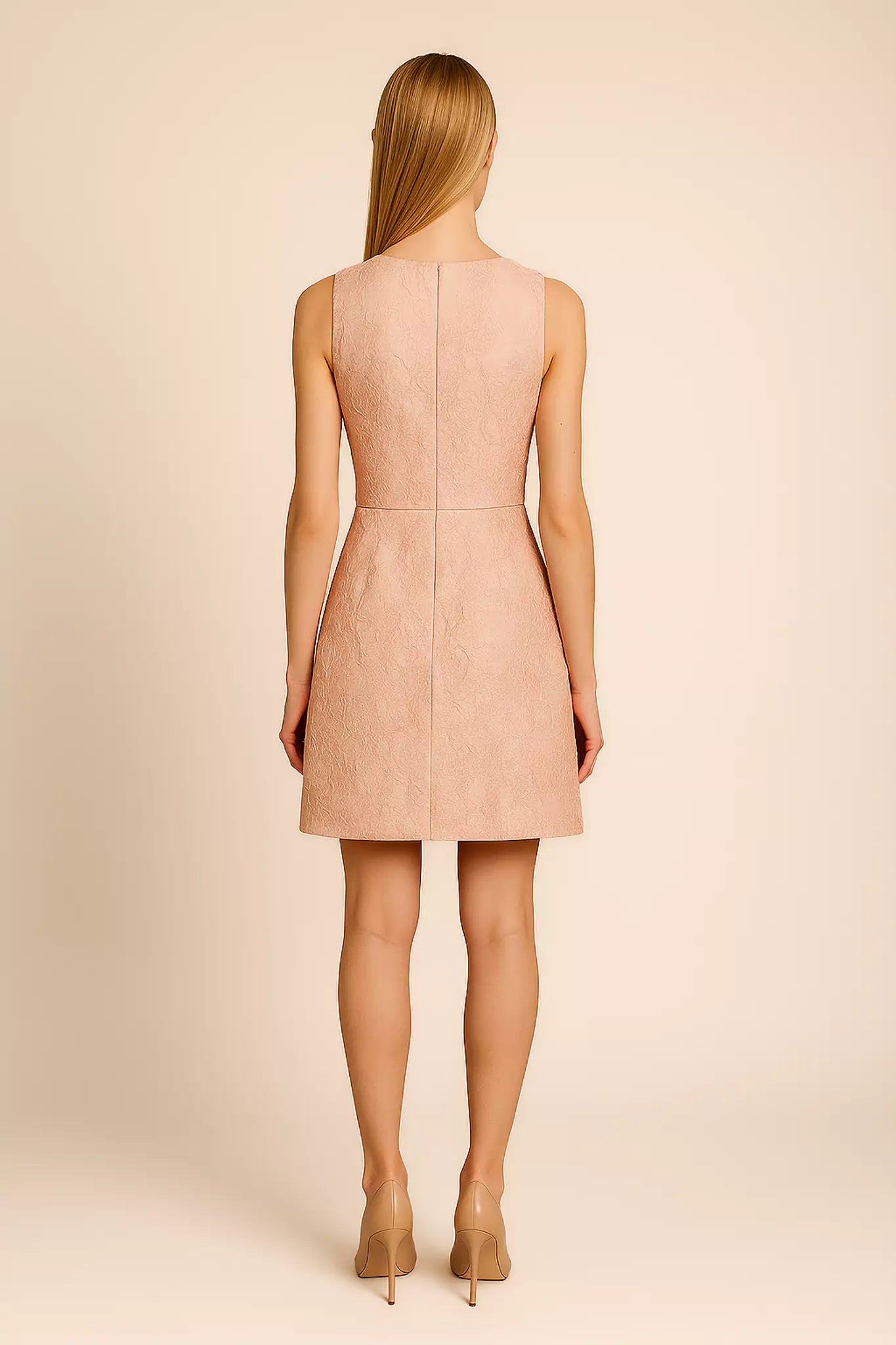 FRAQAIR light pink jacquard cocktail dress, back view worn by model with nude heels against neutral background.