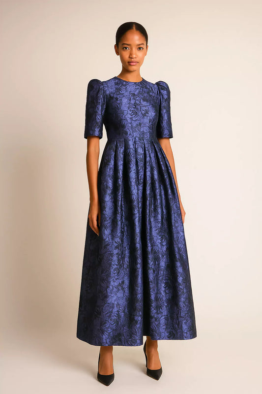Model wearing royal blue jacquard dress with puff sleeves and full pleated skirt – FRAQAIR