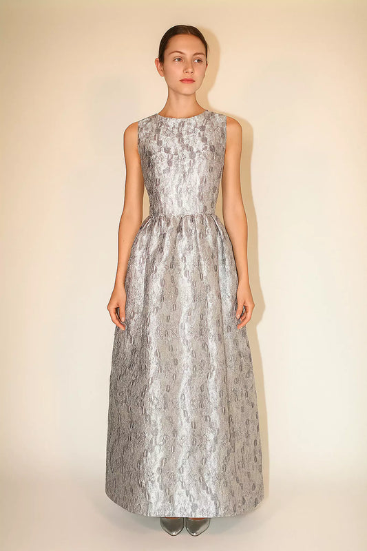 Luxury FRAQAIR silver jacquard maxi dress, sleeveless fitted bodice and flared skirt, front view on model.